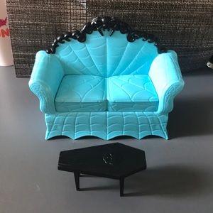 Coffin table and spider web design couch